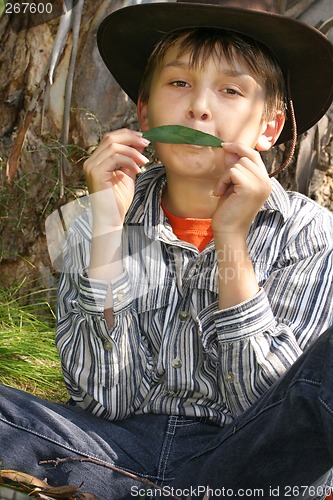 Image of Green Music - A Boy playing gumleaf tune