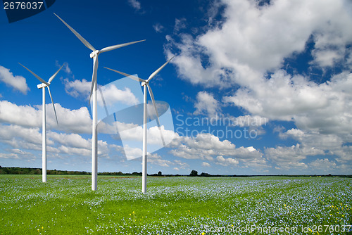 Image of Wind generator turbine on spring landscape