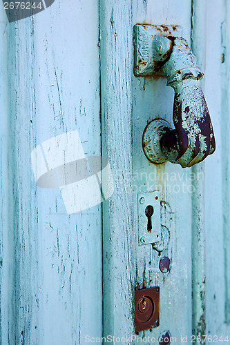 Image of spain  hand brass knocker abstract door wood in the grey