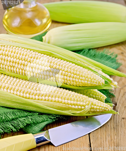 Image of Corncob with a knife and oil on board