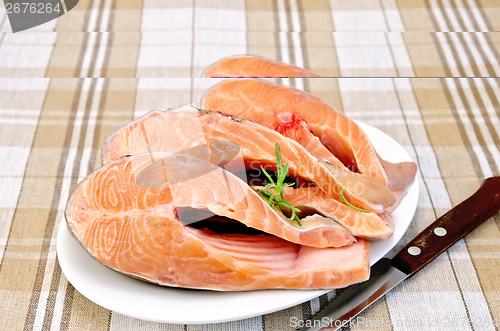 Image of Trout in plate with rosemary on napkin