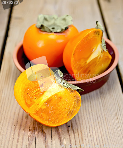 Image of Persimmon on the board in pottery