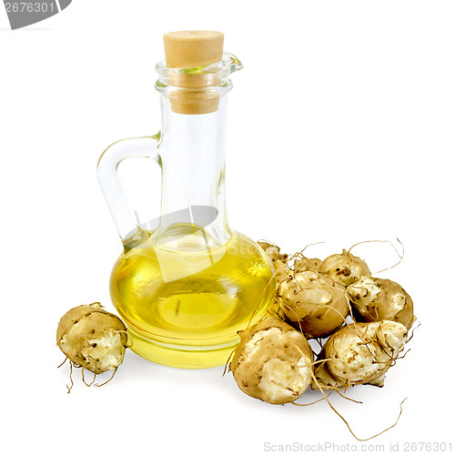 Image of Jerusalem artichokes with a carafe of oil