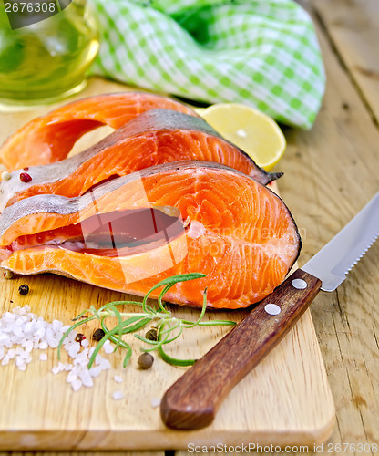 Image of Trout with oil and knife on board