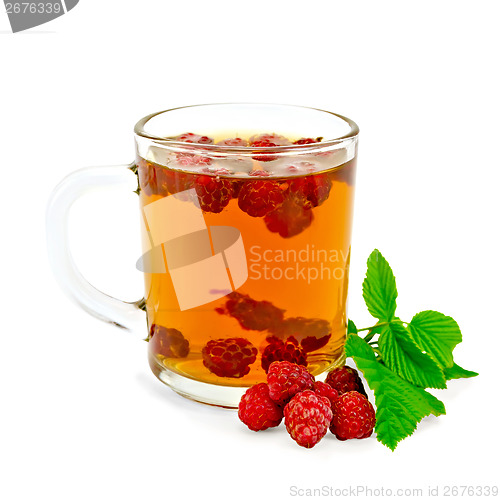 Image of Tea with raspberry and leaf in glass mug