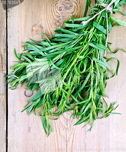 Image of Tarragon on a wooden board