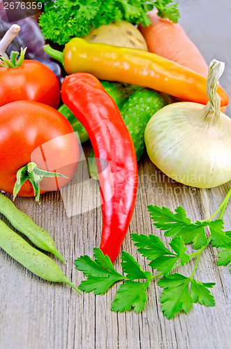 Image of Vegetables with onions and beans on the board