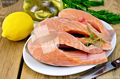 Image of Trout in plate with lemon on board