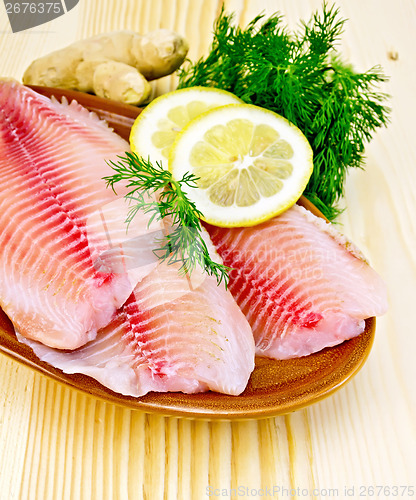 Image of Fillets tilapia in pottery on the board