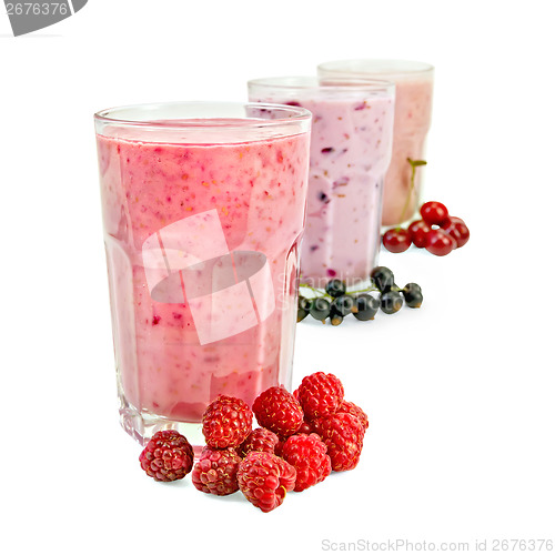 Image of Milkshakes with berries in glass a row