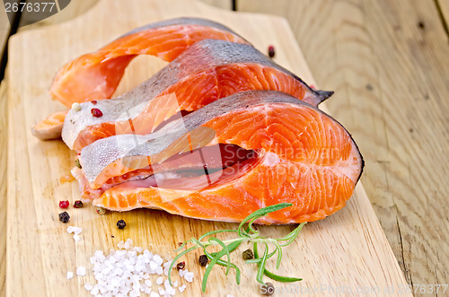 Image of Trout with salt and rosemary on board