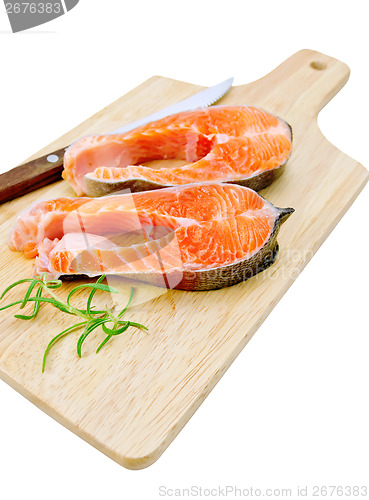 Image of Trout with a knife and rosemary