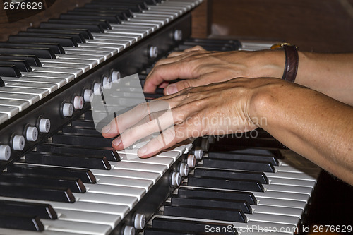 Image of playing piano organ