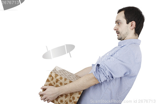 Image of Young man holding a present