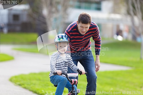 Image of family biking