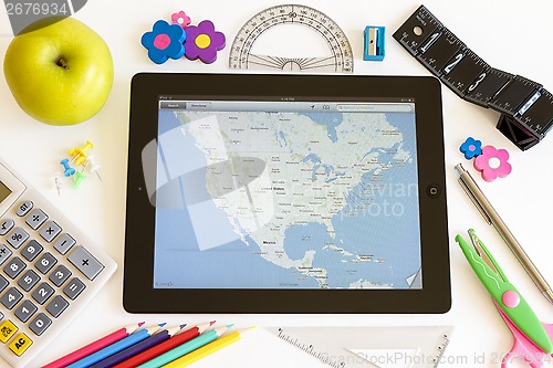 Image of Ipad 3 with maps and school accesories