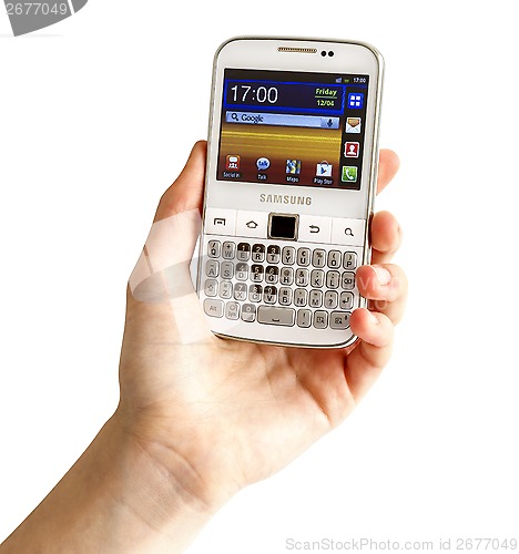 Image of Hand holding Samsung Galaxy Y Pro B5510