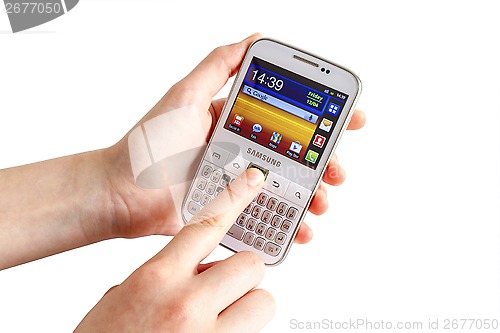 Image of Hand holding Samsung Galaxy Y Pro B5510