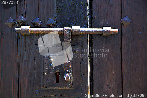 Image of knocker spain castle lock  door wood in the red brown 