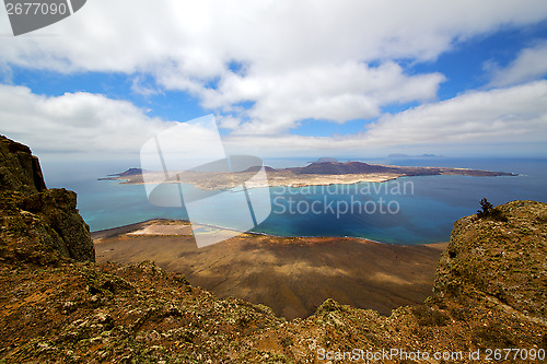 Image of  del rio harbor rock   yacht water  in lanzarote spain graciosa 