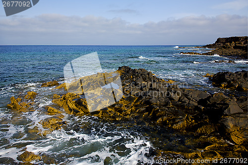 Image of water  in lanzarote  isle foam rock   stone sky cloud beach  