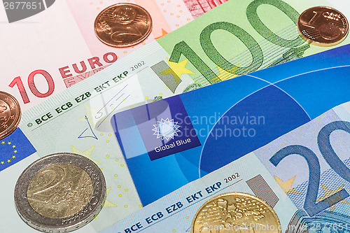 Image of European currency notes and coins with Tax Free plastic card