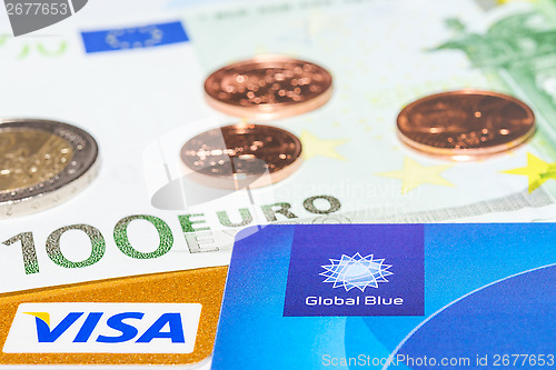 Image of "Global Blue", "Visa" credit card and cash money