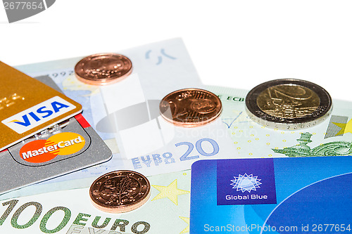 Image of Credit and Tax Free cards on Euro banknotes with coins