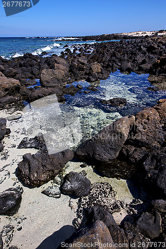Image of  sky light  beach water  in lanzarote  isle foam rock spain  
