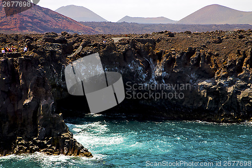 Image of people   coastline  in lanzarote  sky cloud beach   summer 