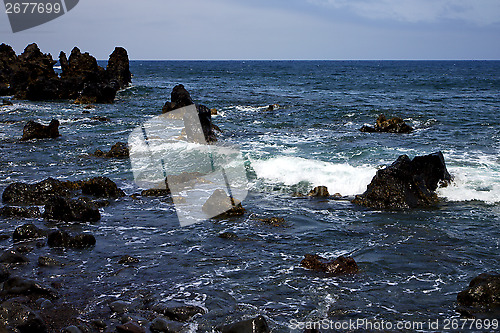 Image of  rock spain  sky light  beach water  in lanzarote foam  landscap