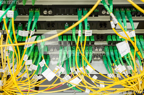 Image of fiber optic datacenter with media converters and optical cables 