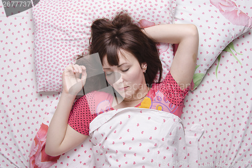 Image of Girl of twenty-five years sleeping in bed