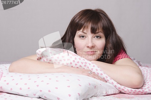 Image of young girl lying in bed