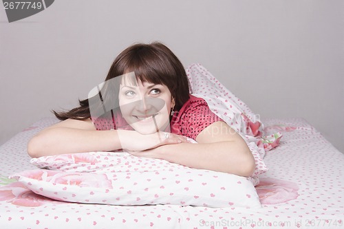 Image of Young girl dreams of lying in bed