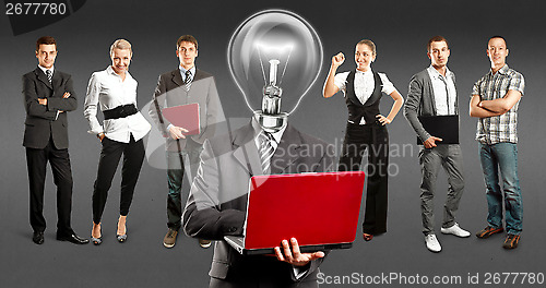 Image of Business Team With Lamp Head