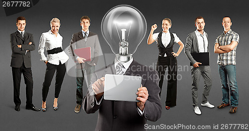 Image of Business Team With Lamp Head