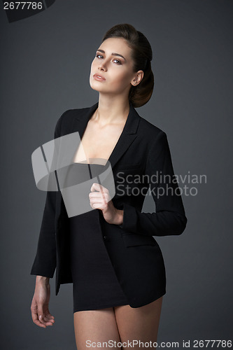 Image of Fashion woman in black dress and jacket