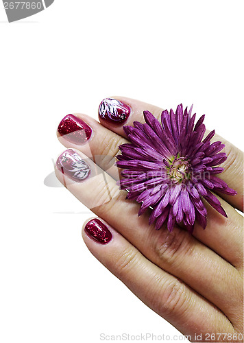 Image of  Woman fingers with decorated nails