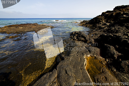 Image of spain musk pond rock stone sky  water   