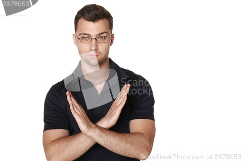 Image of Serious businessman making stop sign