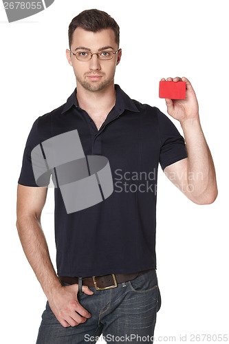 Image of Serious male showing red card in hand