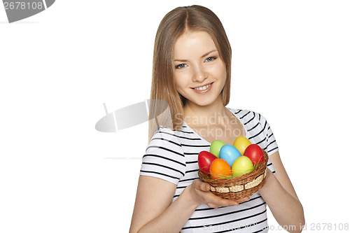 Image of Female holding basket with Easter eggs