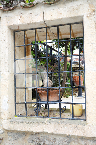 Image of Wrought iron railing in the window.