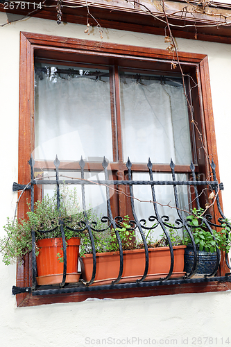 Image of Old window on a white wall.