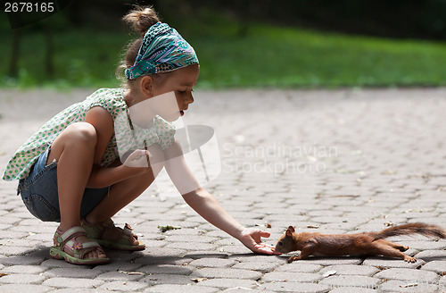 Image of Little girl and squirrel