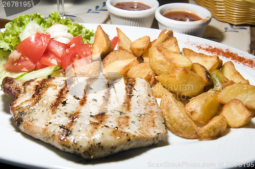 Image of Polish style grilled pork chops meal as photographed in Krakow P