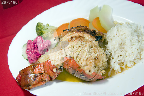 Image of fresh Caribbean lobster tails cooked garlic and butter with loca