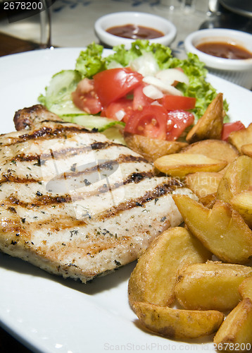 Image of Polish style grilled pork chops meal as photographed in Krakow P