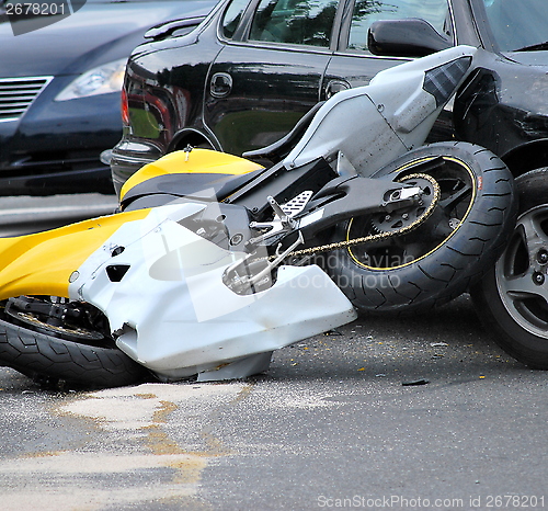 Image of Motorcycle, car accident.